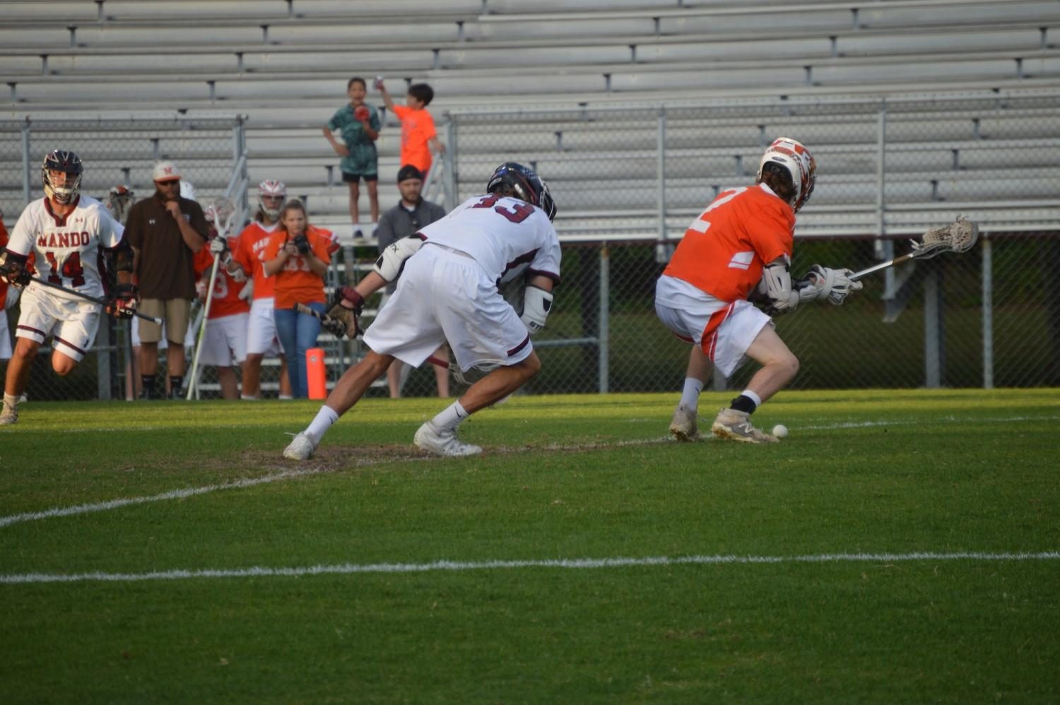 Senior Cole Hartley #33 competes for possession of the ball during their game against Mauldin on April 25