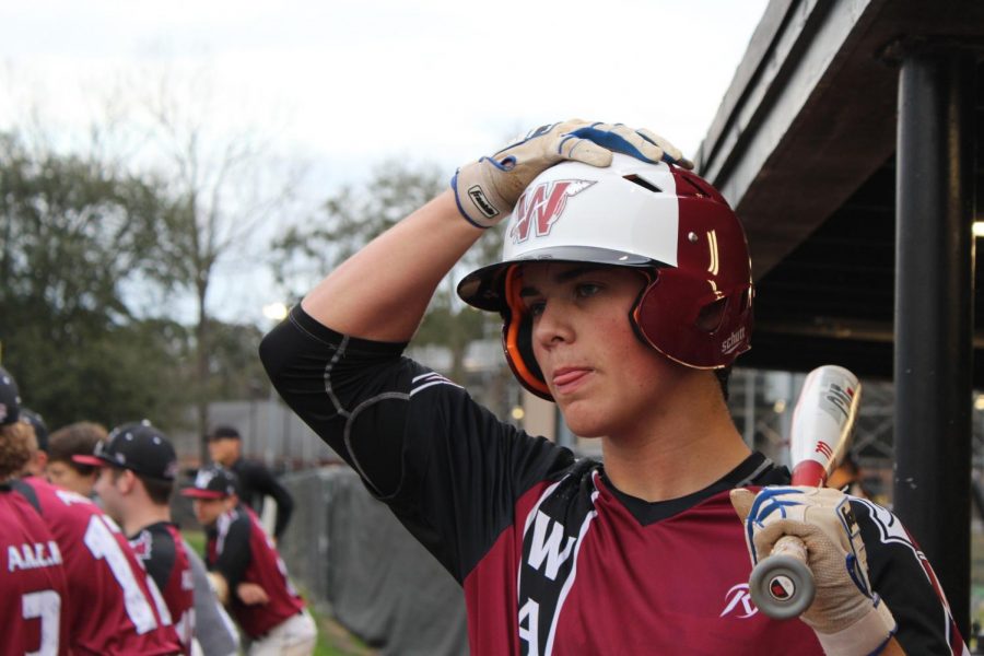 Junior Connor Cino watches his teammates as he prepares to go up to bat during the game against Hanahan on Feb. 14.