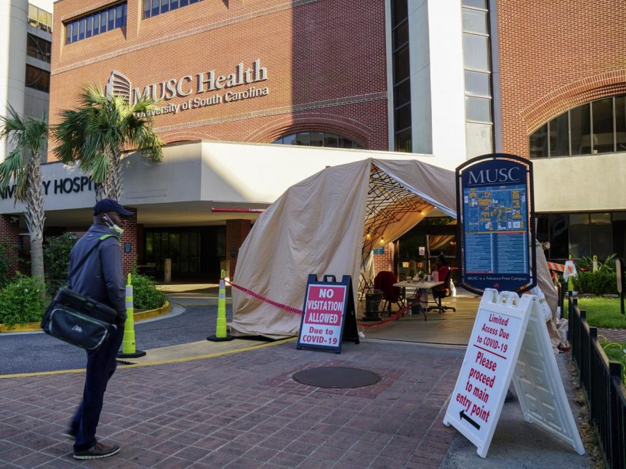 A man with a mask enters MUSC on March 2. A security checkpoint was set up in which visitors and workers alike must pass through to continue into the hospital.