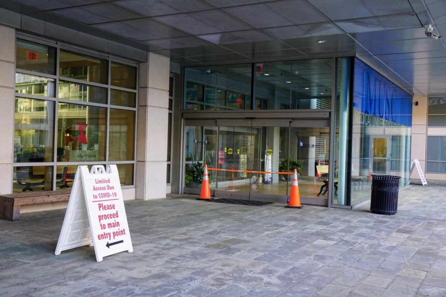 Entryways into the Ashley River Tower were barricaded by cones and nearby campus security on March 2. A checkpoint was set up nearby in which workers could enter through.