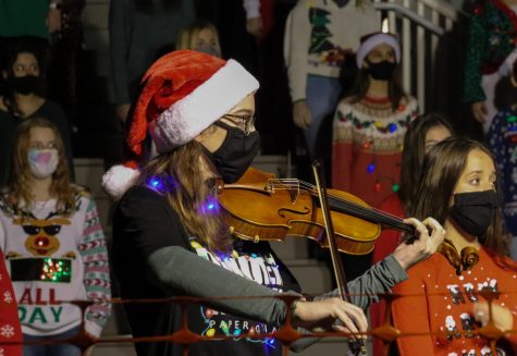 Senior Kate Stribling accompanies the Wando Chorus in many of their Christmas songs at the Sullivans Annual Tree Lighting.