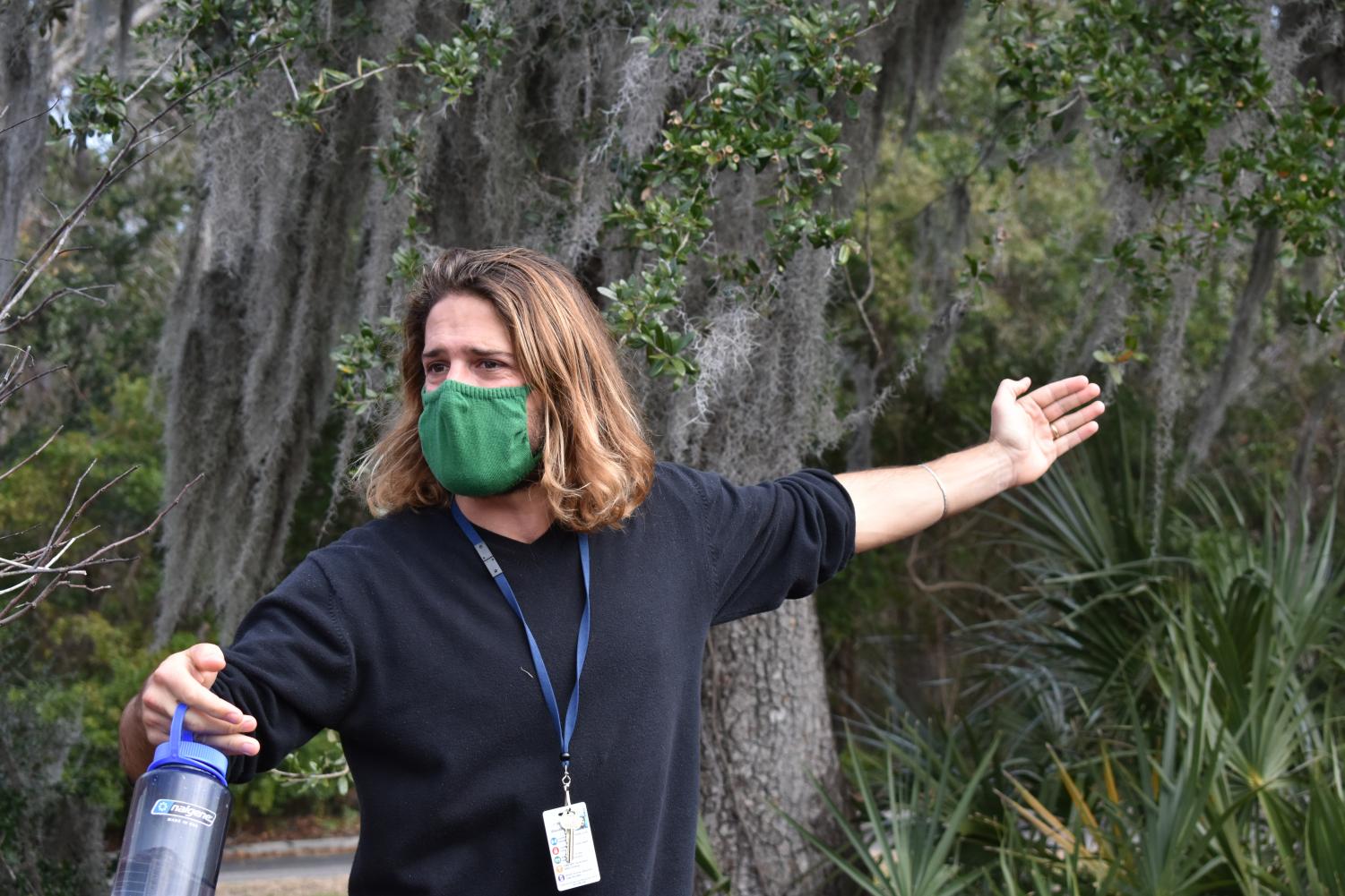 Teacher Joshua Driscoll explains aspects of nature around Wando to students.