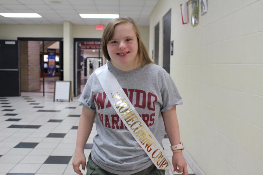 Senior Cate Oxford, who is a member of the homecoming court, dresses in her Wando gear before the big game.
