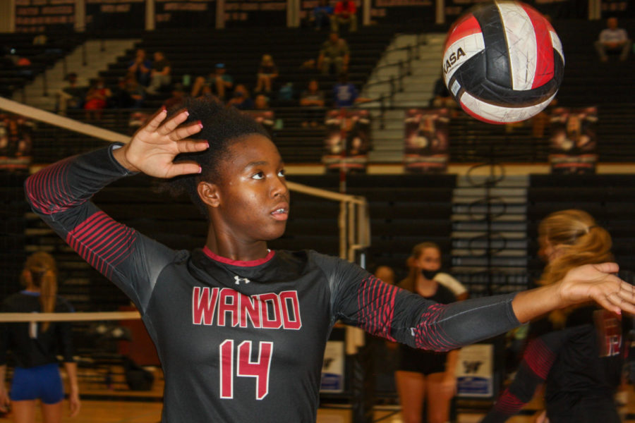 Junior Aurie Fisher stands posed ready to spike the ball versus Cane Bay.