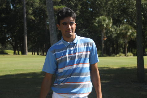 Chawla walks away from the tee after hitting a ball.