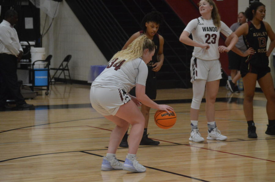 Senior Ava Curry, dribbling the ball preparing for her free throw to get a point for the Wando warriors.
