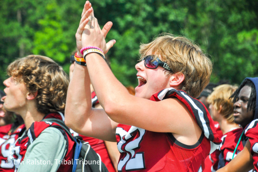 Junior wide receiver/linebacker Max Rhoton claps in celebration during the pep rally. It had been over two years since Wando has hosted a pep rally due to COVID restrictions.