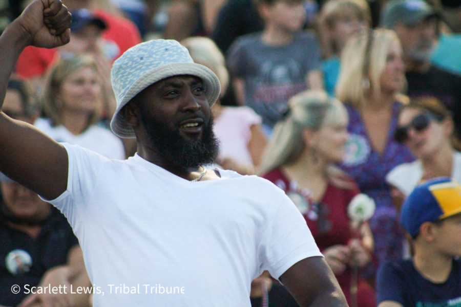 A fan cheers for the Wando varsity football team during the home game against Lucy Beckham on Aug. 26.