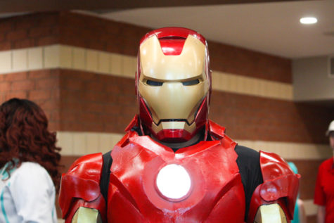 An Incredible Conn attendee in a homemade Iron Man suit wanders the convention center