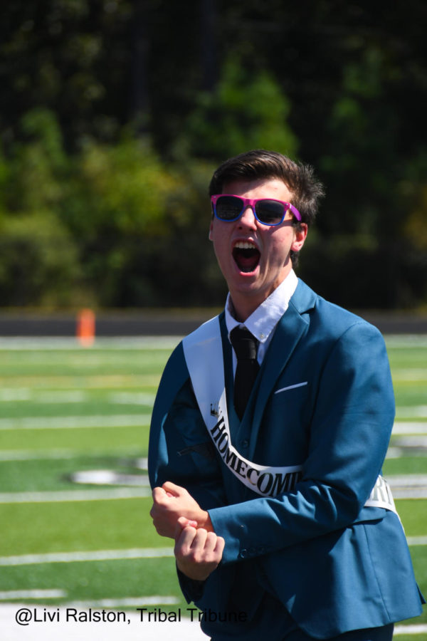 Junior Jack Hipp expresses the excitement of winning homecoming prince. Anxious moments have led up to this relieved feeling. Hipp is sporting bisexual pride glasses during his crowing as well.