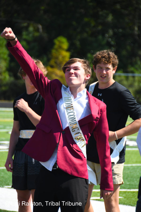 Freshman Ender Kellner throw his enjoyment filled fist into the air as his name was just been announced for the homecoming knight. It was an unexpected win for Kellner but a might one indeed.