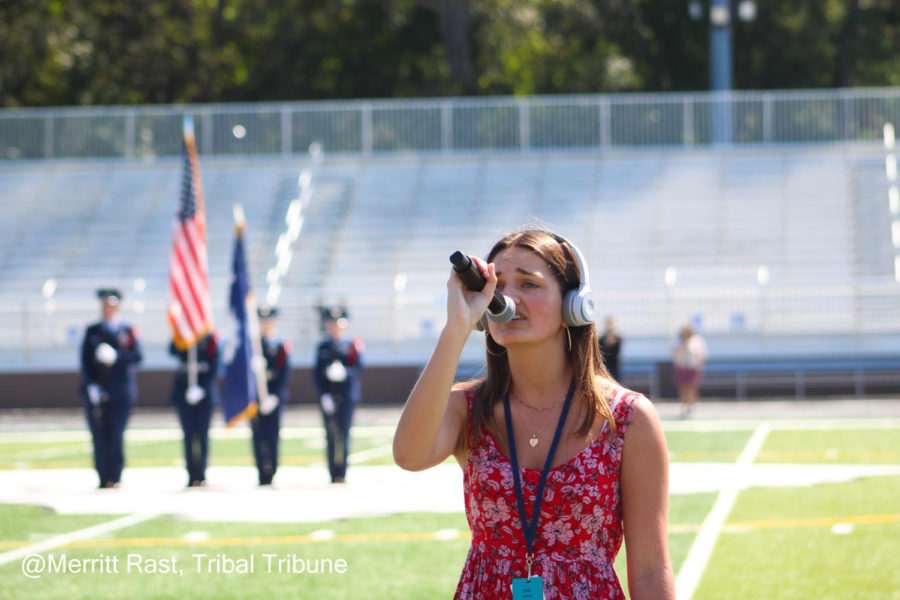 Senior Ellie Laing confidently sings the national anthem infront of all Wando Highschool.