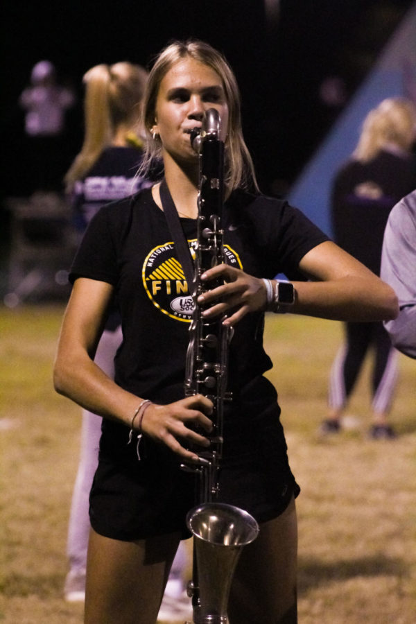 Klein performs on her bass clarinet during a marching band practice earlier this fall