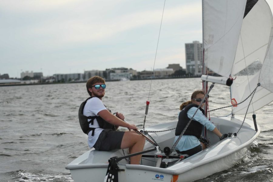 In the middle of the Charleston harbor, students Langdon Wallace and Madeline Harris work together to maneuver a two-man sailboat, showcasing their sailing skills. Harris sad that sailing is difficult because one has, to be extremely aggressive, theres a ton of strategy involved in it, and strength and training that goes into it