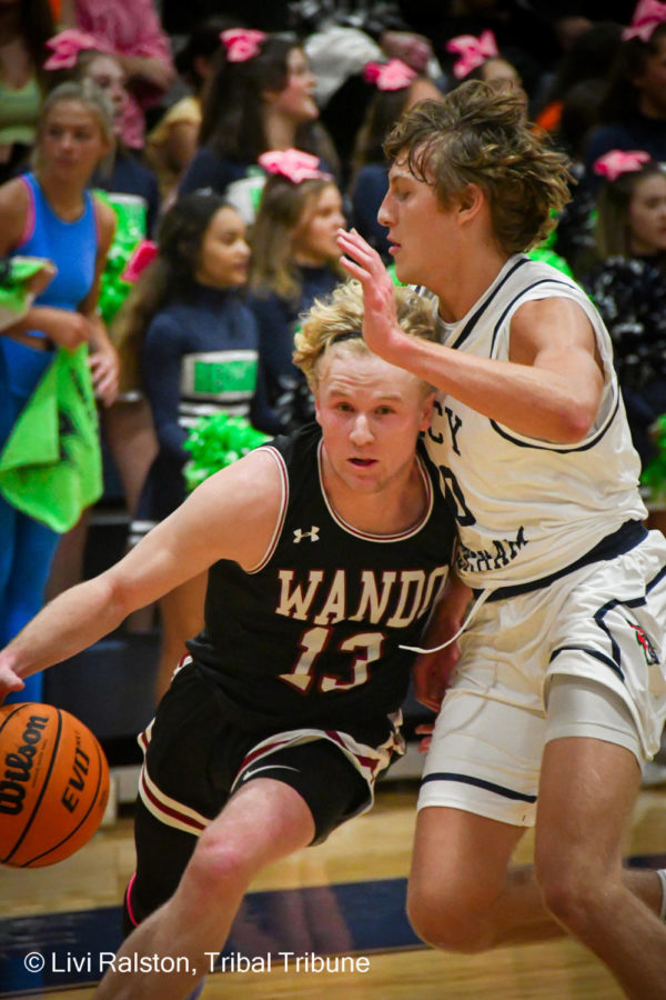 Senior Rhett Norris drives the ball against the Lucy Beckham team and makes his way to the basket.