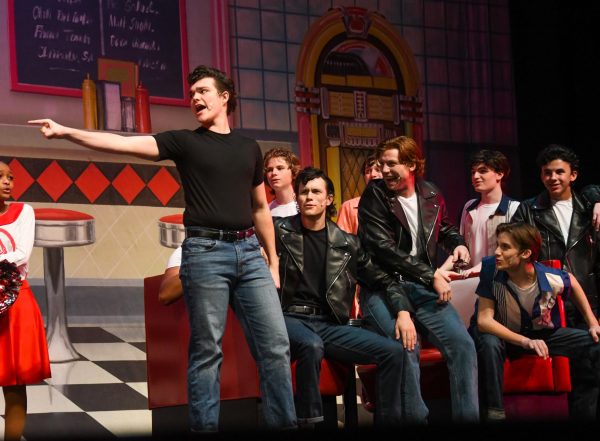 Senior George Minister plays the lead in his theater’s production of ‘Grease’. ”You have to have that technical skill to be able to perform at a level that people expect,” Minister said.