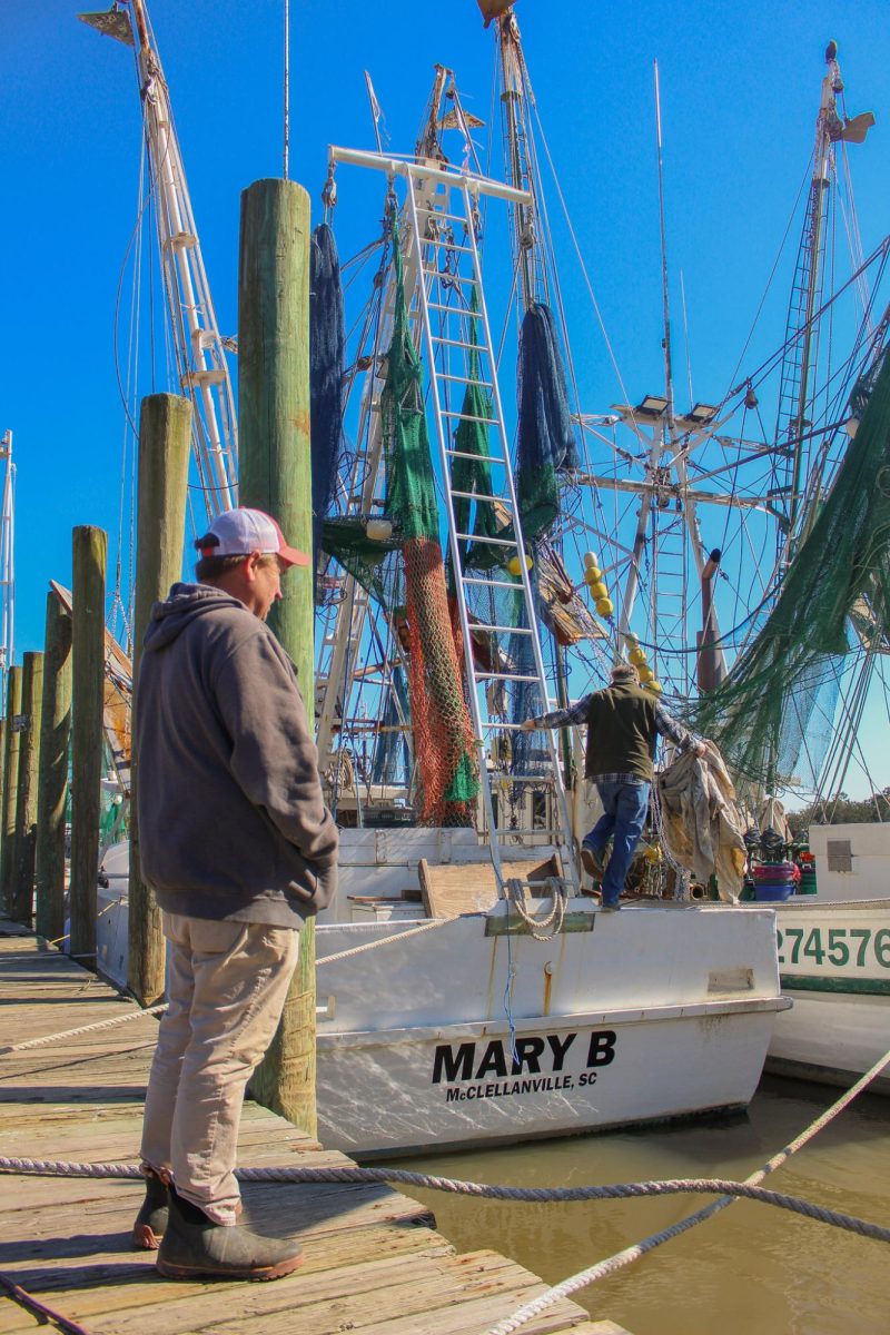 Local shrimper Wade Rhodes overlooks the boats docked in McClellanville. “My job at Carolina Seafood is mainly getting the shrimp boats and fish 
boats that sell to us unloaded and keeping up with the product coming and going,” Rhodes said.