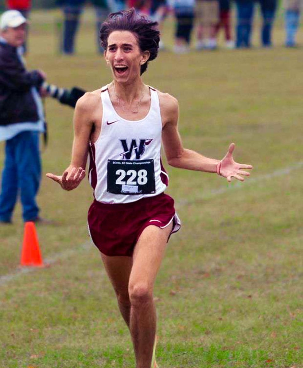 Senior Jake Liebert races to the finish line during the 2022 cross country state meet where he won his second individual state title. “I was just really excited because I won state and it was kind of a stressful experience so to win it and be relived was awesome,” Liebert said.