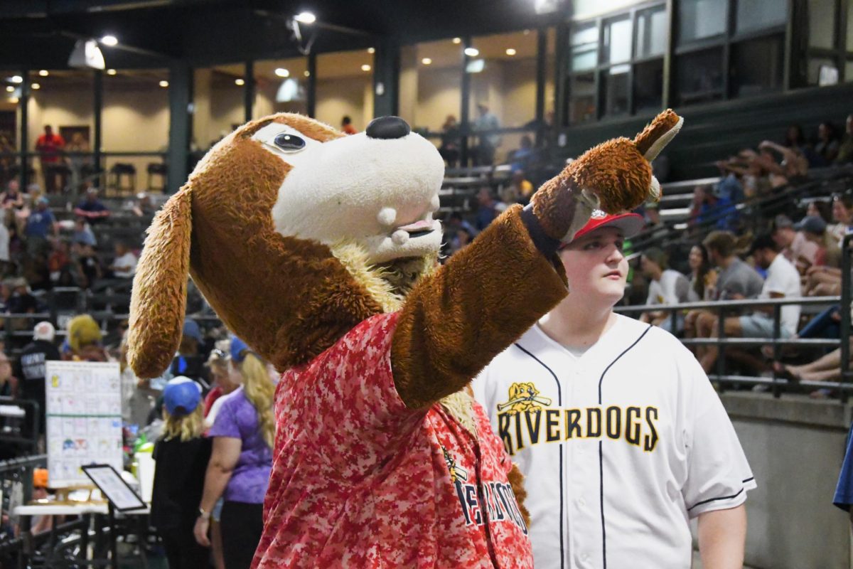 Junior Bryant Bishop functions as one of the mascot's handlers. "Schneider pointed to somewhere that he was going to go [and] I basically just have to follow him around," Bishop said. 