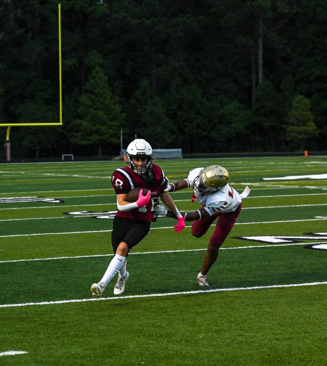 Warrior running back Luke Chenoweth jukes an opposing player for a big play.