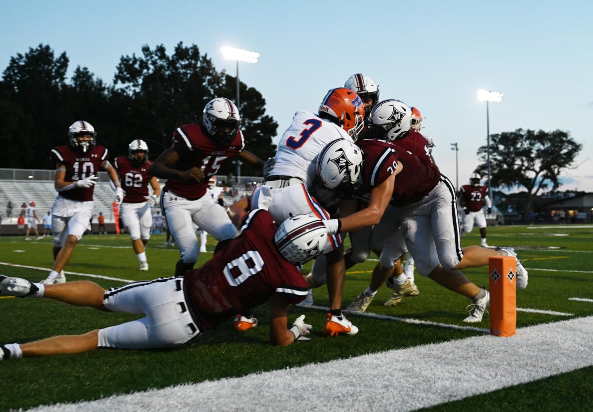 Warrior football player, Cole Fletcher makes a safety in the endzone.