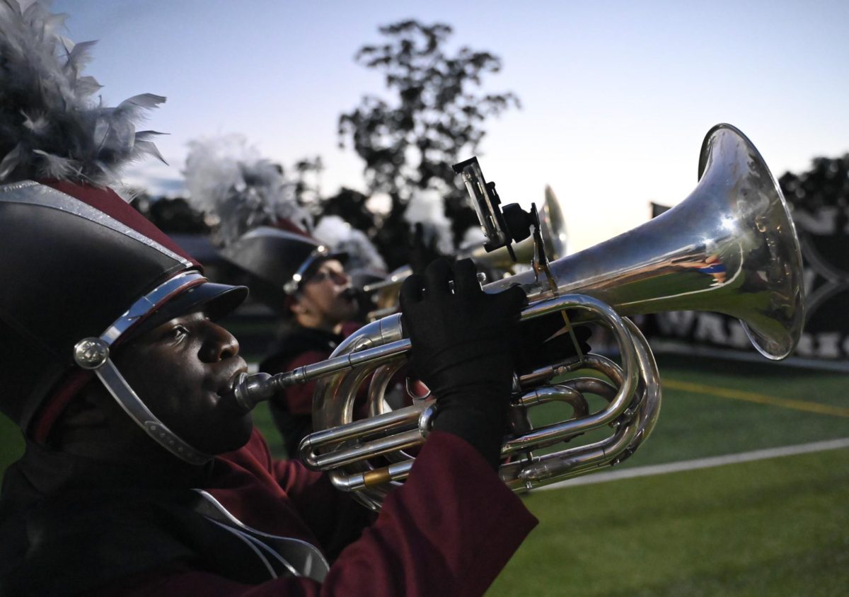 Sophomore Austin Horry plays the Star Spangled Banner before the game