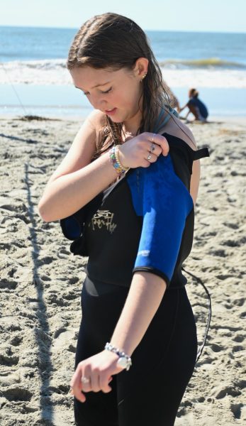 Senior Ella Hagemann gets ready for a dive on Isle of Palms as she puts on her wet suit. “You’re like in a whole different world... you’re like kind of weightless with like your buoyancy and it’s just really neat because its relaxing, it’s like going to the aquarium but like being a fish.”
