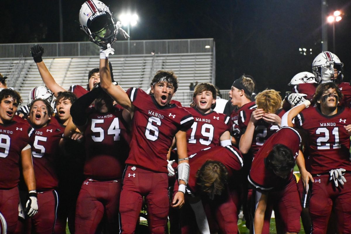 Junior Receiver David Vennard shouts towards the crowd as team celebrates their win.