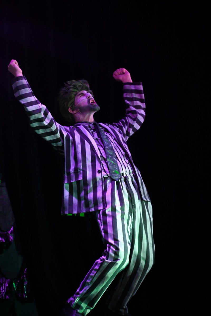 Senior Jeremy Rokos puts his all onto the stage in a important scene as Beetlejuice. "it meant the world to me, Beetlejuice is my favorite musical and being able to do that as my senior show meant....everything to me." Rokos said. 