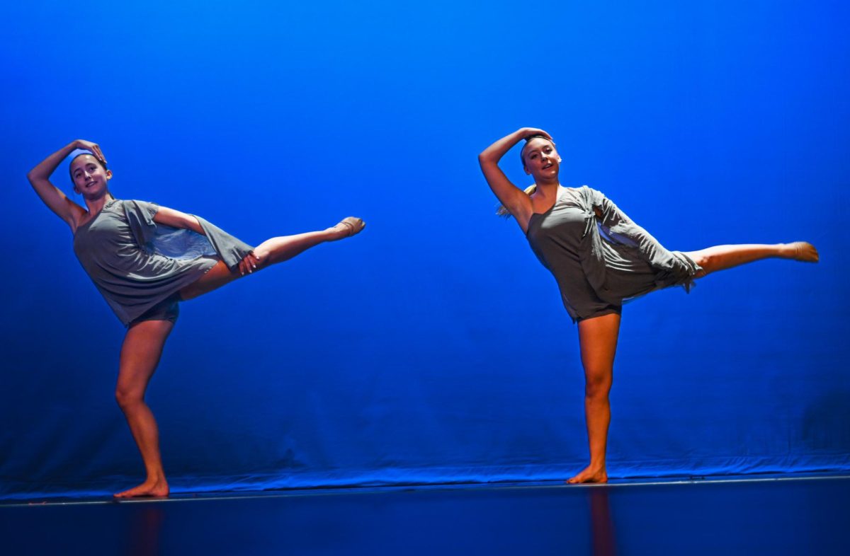 Sophomore Ginny-Kate Caslon and Junior Kaelyn Elder follow a routine in sync.