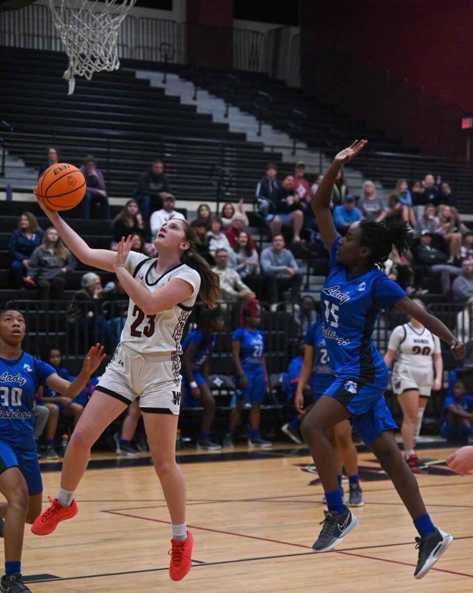  Senior Forward Grace Wilcenski rushes to the basket to secure a layup. “It felt good to score when someone was definitely passing me to make sure it’s not going out of bounds,” Said Wilcenski. 