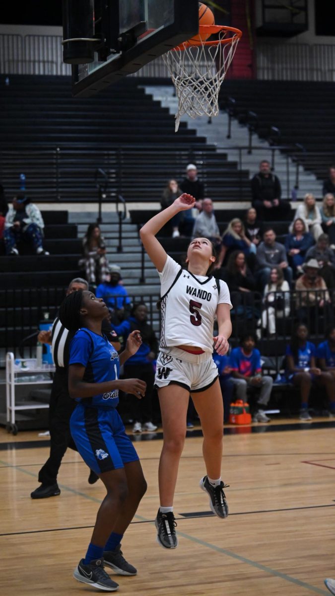 Junior Abby Monaghan goes in for a layup scoring in the process 