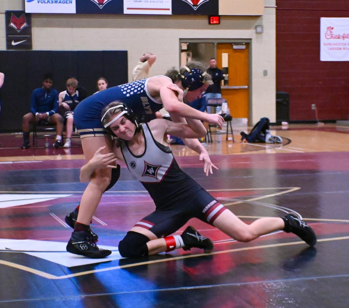 Sophomore Abigail Phillips takes down a competitor. "My brain shuts off when I wrestle. It's just muscle memory at this point," Phillips said.