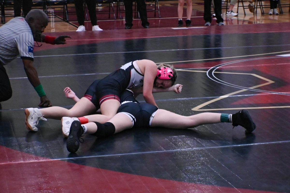 Junior Ella Mathewson faces certain stereotypes as a female wrestler. "Usually we're with the guys, but for [the match against Ashley Ridge High School], it was just us girls against another girls team," Mathewson said. "It's definitely something like people wouldn't expect."