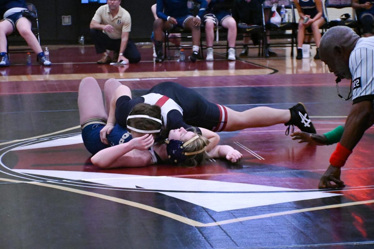 Senior Natalee Wright competes in her first match." I think it's so cool what the human body is capable of," Wright said. "It's so cool to, like, push yourself and makes you feel strong and just super capable when you're pushing yourself and wrestling."