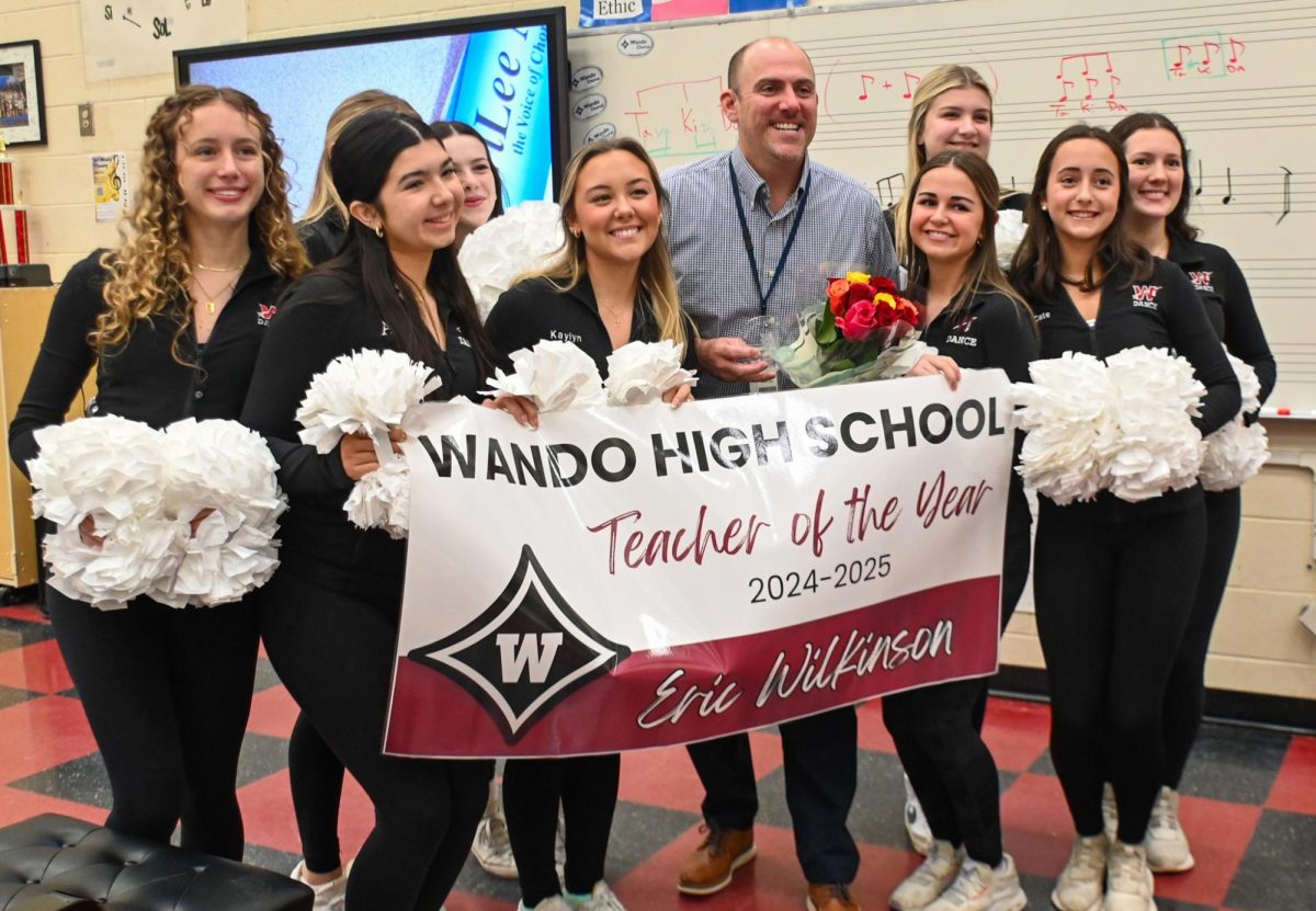 Eric Wilkinson, the winner of Wando's teacher of the year award is a Chorus teacher and works alongside local middle school chorus teachers in support.