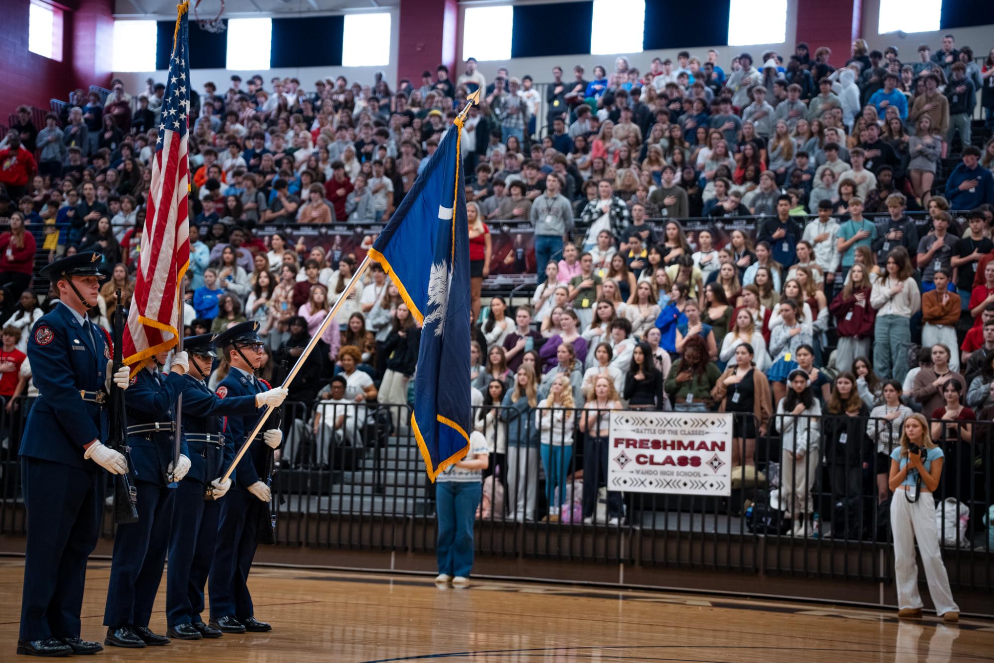 Wando's Airforce JROTC students hold the flags of the nation and the state during the national anthem.