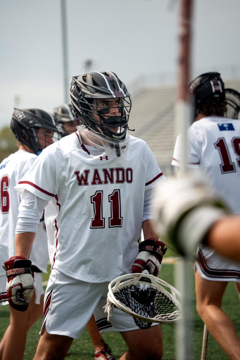 Senior goalie Connor Kramer celebrates with teammates after making a clutch save. 