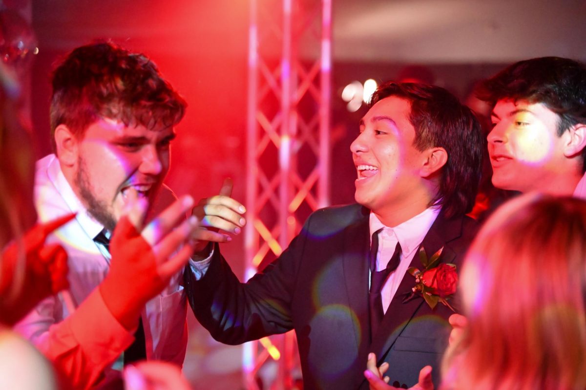 Senior Matthew Hickock enoys a moment with Senior Lawson Odom at their senior prom.