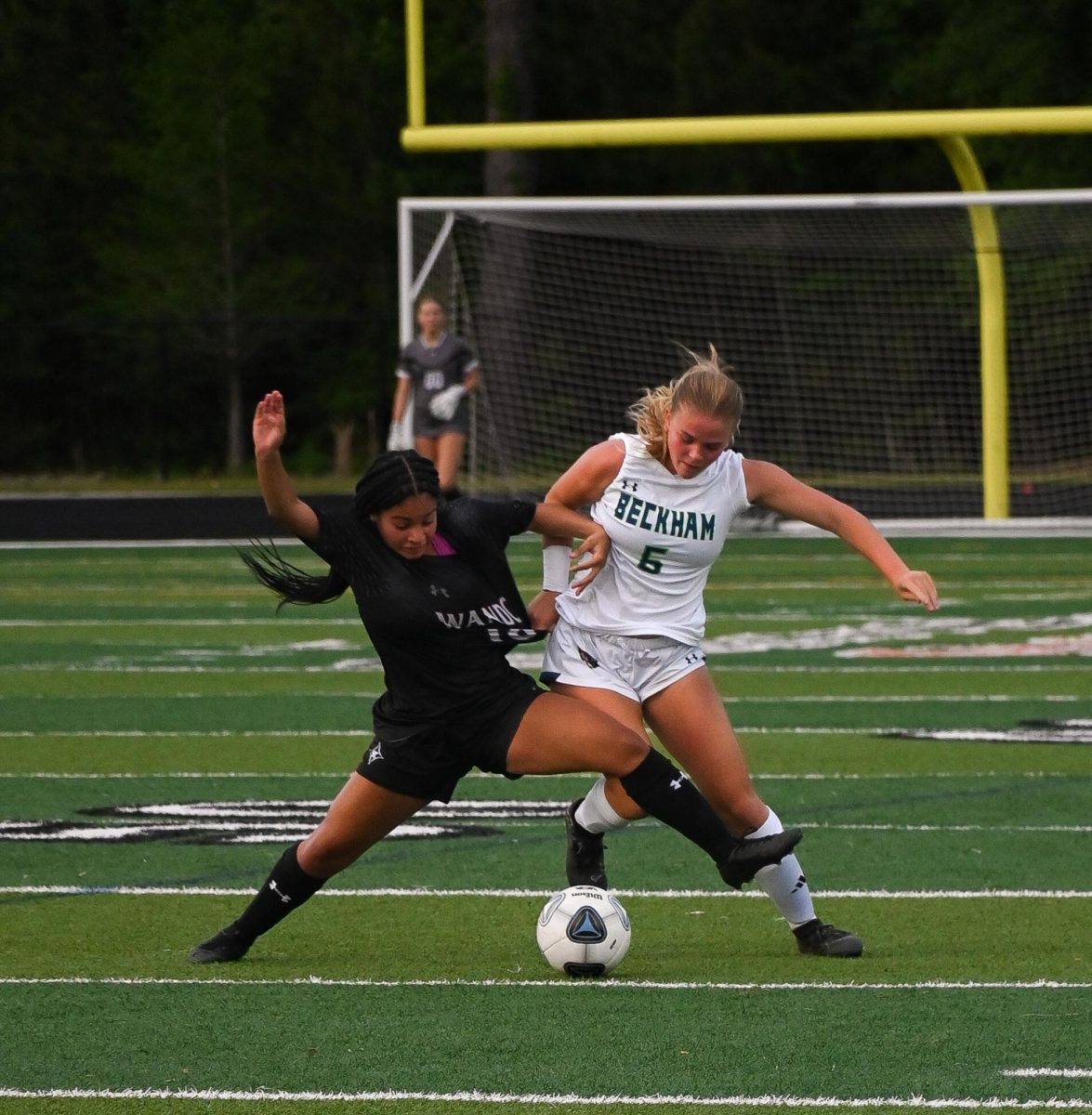 Sophomore Foward Zoey Carter defends the ball from a Lucy Beckham player.