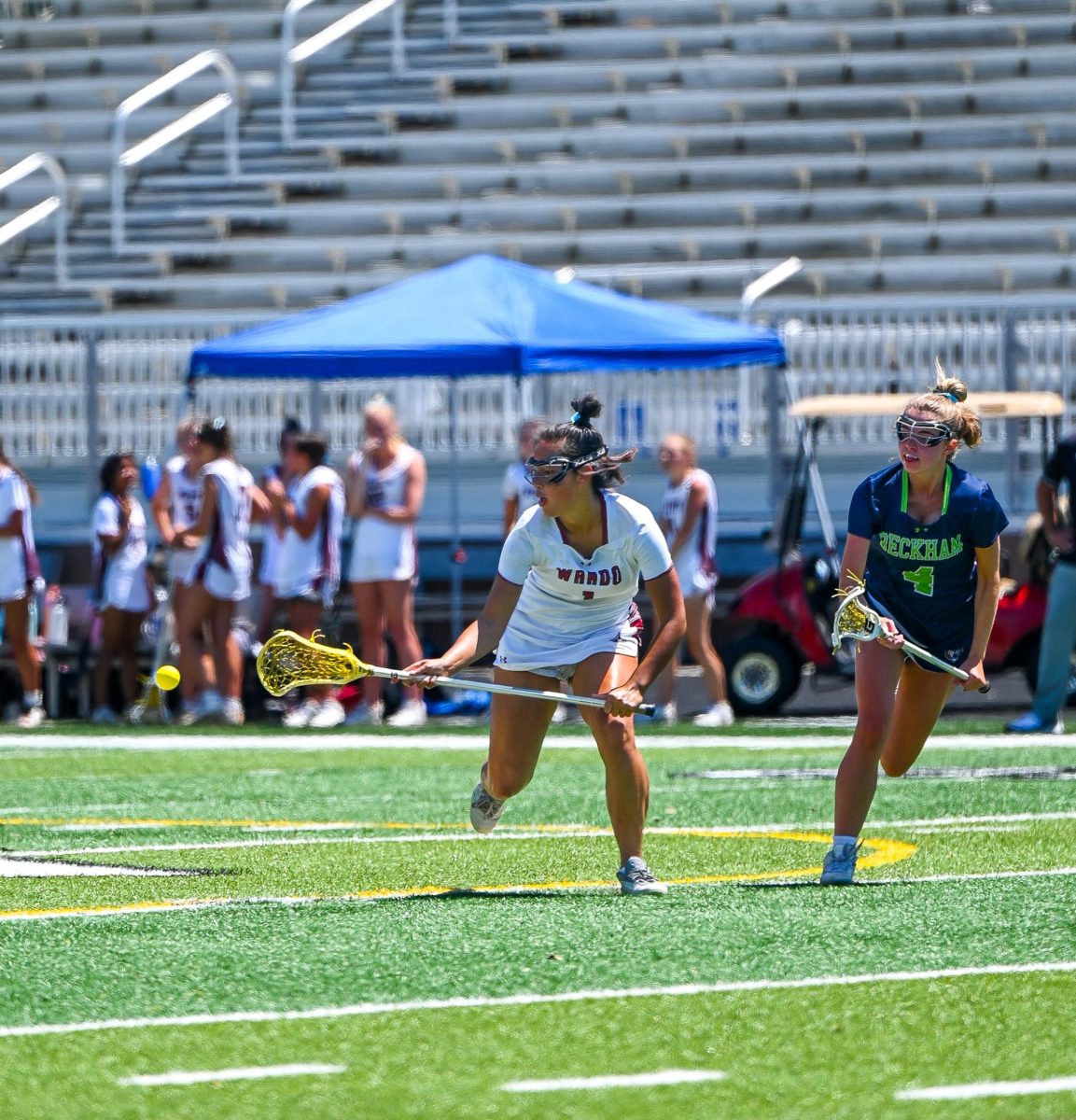 Senior Midfielder Cassie Frye passes the ball.