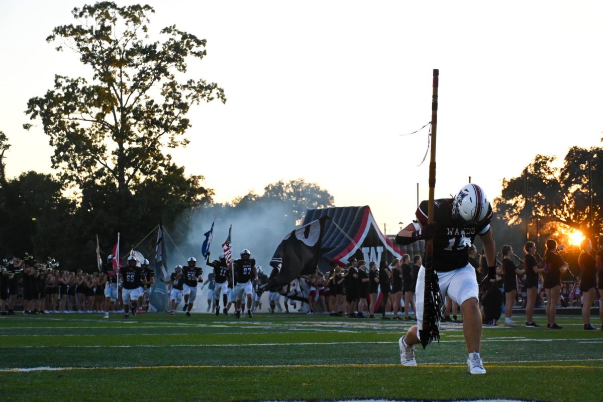 Junior LB Ben Eikenberry holds the spear at the beginning of the game. 