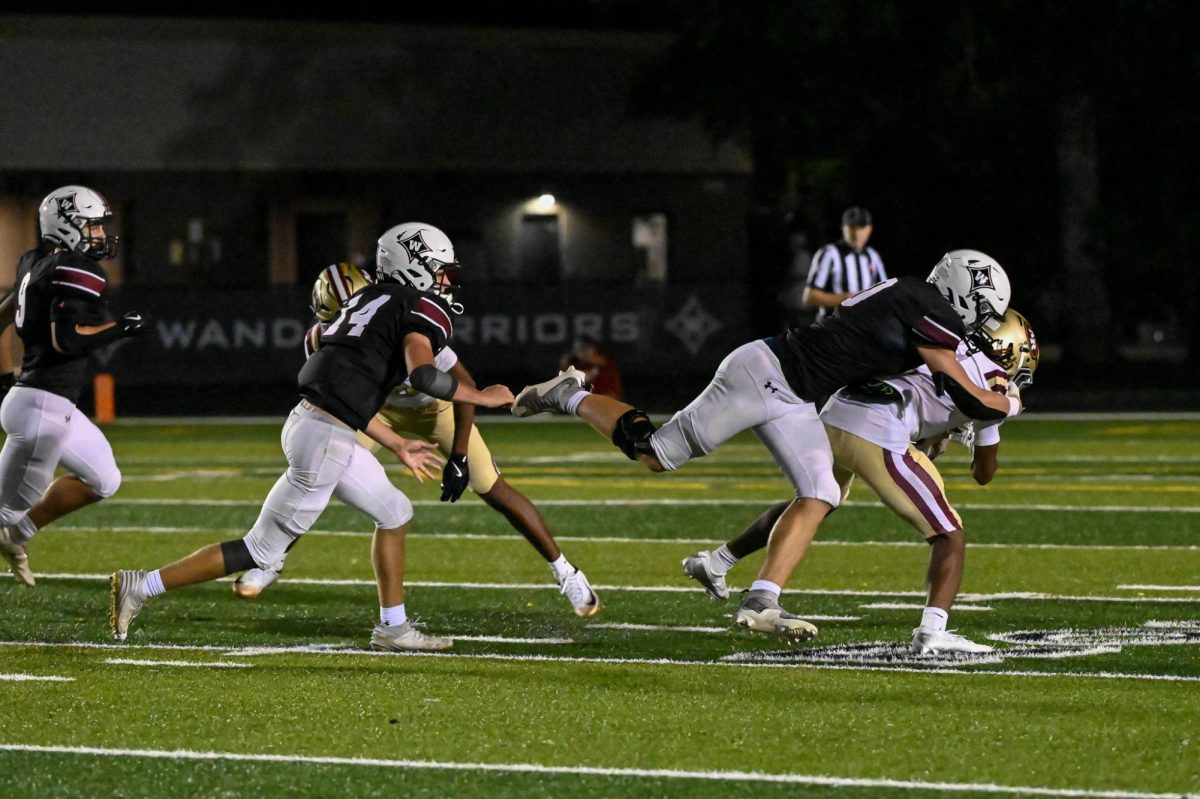 Senior DB Brandon Marcus runs a play on the field. 
