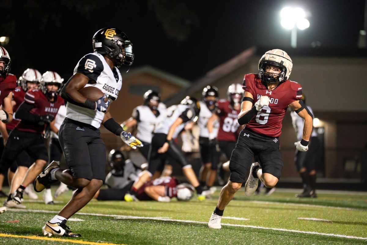 McCarty tracks the Goose Creek running back during an opposing outside run to the right. McCarty sets an interdiction path to either hit the running back or force him out of bounds.