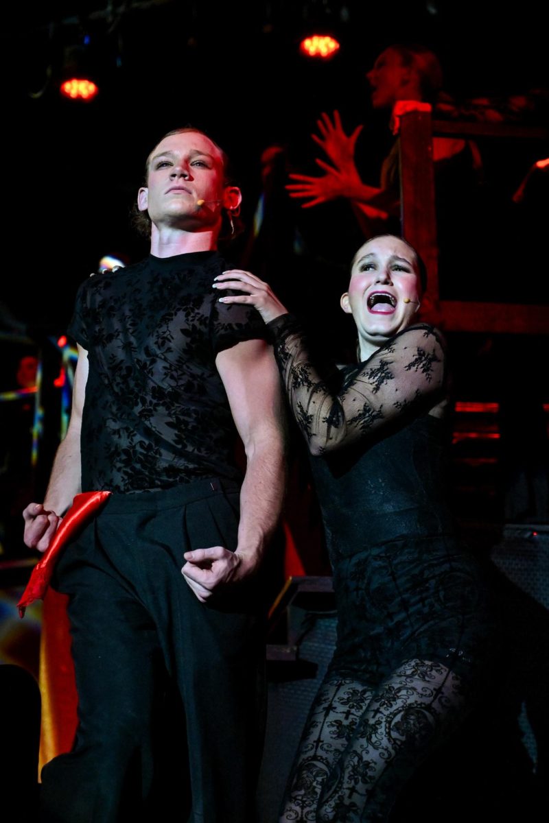 Senior Dominic Weiss and Senior Caris Clark perform in the song "Cell Block Tango" in the musical "Chicago."
