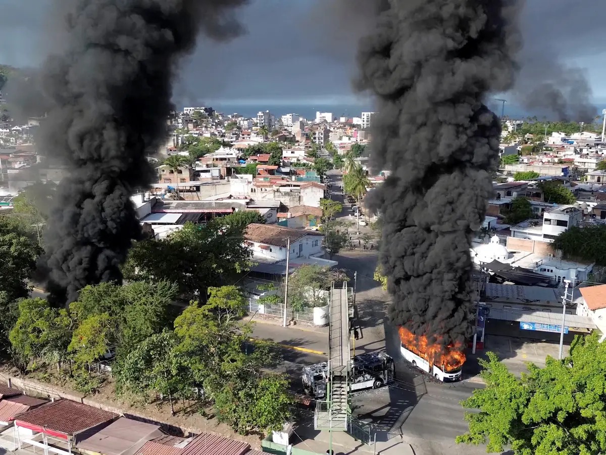 Vehicles engulfed in gasoline fires litter the streets of Puerto Vallarta. Photo // Provided by Elizabeth Clouse.