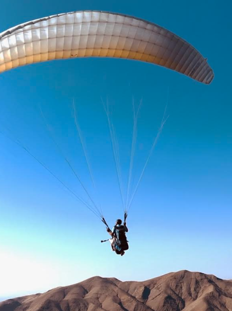 Junior Sydney Elisei para-glides over the Atlas Mountains of Africa. Photo // Provided by Sydney Elisei 