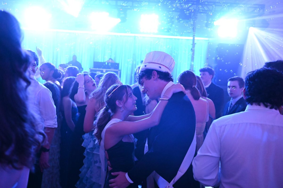 Senior Brody Mancusi shares a dance with his girlfriend, senior Ruth Lee, after they won prom king and queen. "It was pretty surreal, but it was really cool to just hear my name and have all my friends cheer and be happy for me," Mancusi said.