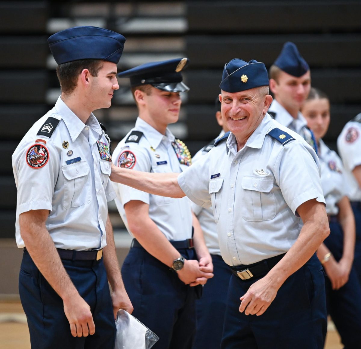 Major John Farese congratulates Senior Cameron Curtis, a Squadron Commander.