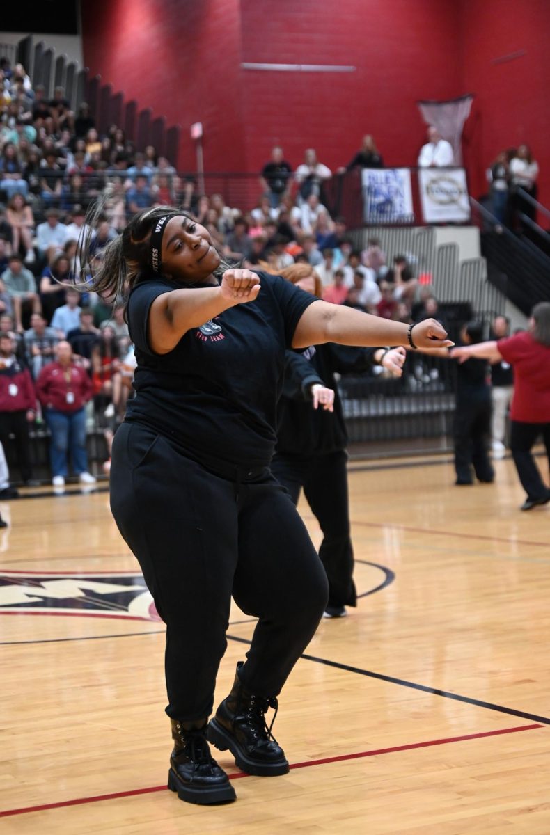 Junior Zanaya Howard performs at the Spring pep rally. “My favorite thing ... [is] coming together and performing in front of the school or at event,” Howard said.